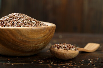 Canvas Print - flax seeds in a wooden plate