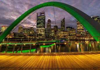 Wall Mural - Elizabeth Quay Bridge after sunset, with Perth city in background. Reflections off water. 