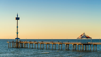 Wall Mural - Iconic Brighton Jetty with people at sunset, South Australia