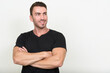 © Ranta Images - Portrait of handsome bearded man against white background