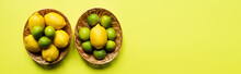 Top View Of Ripe Limes And Lemons In Wicker Baskets On Colorful Background, Panoramic Crop