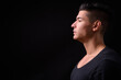 © Ranta Images - Young handsome multi ethnic man against black background