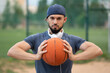 © Vladimir - Portrait of a man with a basketball in his hands