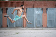 © Vladimir - Athlete runs fast in the street yard