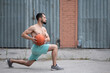 © Vladimir - Man does a warm-up before playing basketball on the street