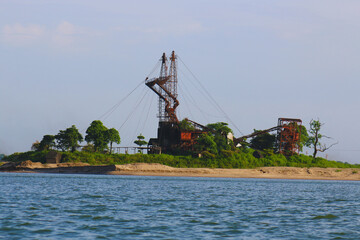 Floating crane over the river on the blue sky background