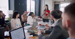 © vadim_key - Young beautiful serious brunette female boss leading multiethnic office meeting seminar in loft modern light coworking.