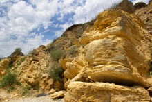 Yellow Color Warm Sandstone Mountain With Blue Sky And Clouds On Summer Black Sea Wild Beach Relax On Nature Concept 