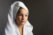 © QKon Studio - adorable little girl happy smiling after spa bath on a white bath towel head