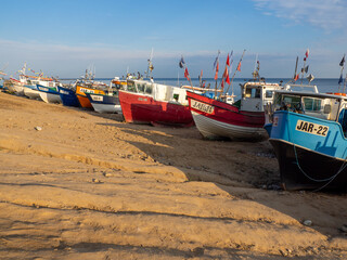 Wall Mural - At Beach of Jaroslawiec in Poland fishing boats lie on the beach of the Baltic Sea