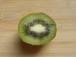 Wall Mural - Green color sliced cut ripe Kiwifruit
