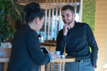 Startup Diversity Teamwork Brainstorming Meeting Concept.Two Business Coworkers discussing about Economy situation in their companies. People Working Planning Start Upand  Discussing inside Cafe bar.