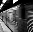 © Camilo Herrera Photo - NYC subway station train in motion Black and white