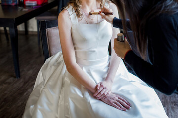 Canvas Print - the bride in wedding dress is sitting in morning