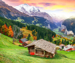 Scenic autumn view of picturesque alpine Wengen village and Lauterbrunnen Valley