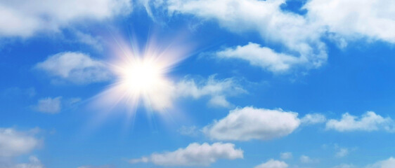 Wall Mural - natural summer background, sun over blue sky with white clouds.