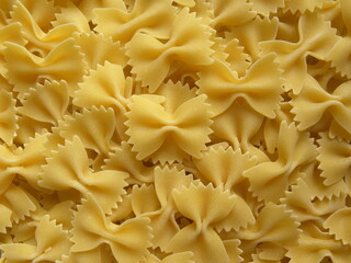 Wall Mural - Yellow color raw whole Bow tie pasta