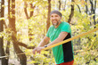 © yanik88 - Portrait of a mature sports man with a beard next to a stretched slackline in the autumn forest in the afternoon. the concept of sports after 40 years