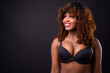 © Ranta Images - Young beautiful African woman against black background