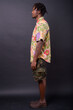 © Ranta Images - Young African man with dreadlocks against black background