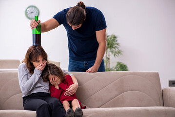 Wall Mural - Young couple and their daughter in family conflict concept