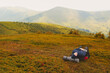 © Myshkovskyi - Young blonde woman tourist resting on a hiking backpack in the mountains