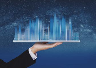 businessman holding blue modern buildings hologram on hand