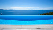 Beautiful blue infinity pool with a sea view