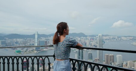 Wall Mural - Woman enjoy the city view in Hong Kong