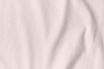 Texture and background of crumpled cream fabric