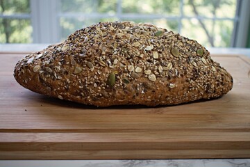 Close up on Harvest bread loaf covered in seeds