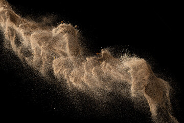 Wall Mural - Gold sand explosion isolated on black background. Abstract sand cloud.