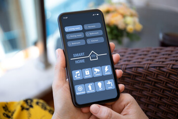 female hands yellow dress hold phone with smart home application