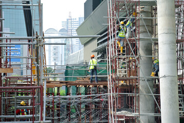 Wall Mural - JOHOR, MALAYSIA -APRIL 13, 2016: Scaffolding used as the temporary structure to support platform, form work and structure at the construction site. Also used it as a walking platform for workers. 
