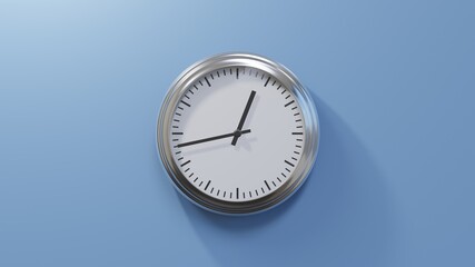 Glossy chrome clock on a blue wall at forty-three past twelve. Time is 00:43 or 12:43