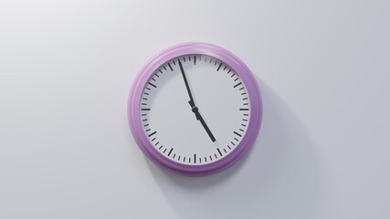 Glossy pink clock on a white wall at fifty-seven past four. Time is 04:57 or 16:57