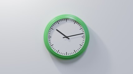 Glossy green clock on a white wall at thirteen past ten. Time is 10:13 or 22:13