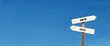 © Win Nondakowit - the way forward from the old to the new. word on signposts with copy space on the panoramic sky background. business opportunity and change improvement concept.