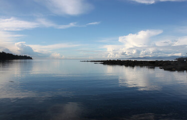 Wall Mural - Pristine water scenes with reflections and brilliant blue skies