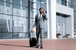 Happy African Businessman Chatting On Phone Arriving At Airport, Full-Length