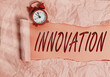 Word writing text Innovation. Business photo showcasing the application of better solutions that meet new requirements Rolled ripped torn cardboard placed above a wooden classic table backdrop