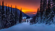 Red Sky As The Sun Sets Behind The Village Of Sun Peaks Resort In The Shuswap Highlands, British Columbia, Canada