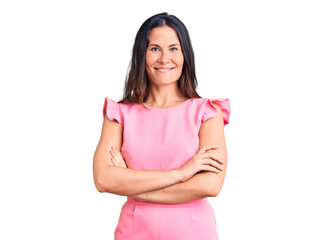 Young beautiful brunette woman wearing casual dress happy face smiling with crossed arms looking at the camera. positive person.