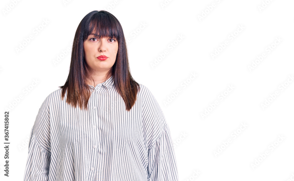 Young plus size woman wearing casual clothes depressed and worry for distress, crying angry and afraid. sad expression.