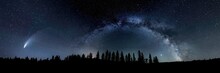 Night Sky With The Milky Way And Comet Neowise Looking Like The Christmas Star And A Silhouette Of Pine Trees Along The Horizon.