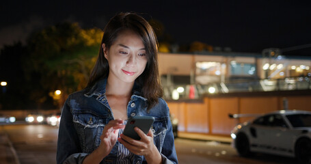 Canvas Print - Woman call for taxi at street in the evening