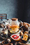 Fototapeta Na sufit - Hot tea with slices of fresh grapefruit on wooden tablet. Healthy drink, Eco, vegan