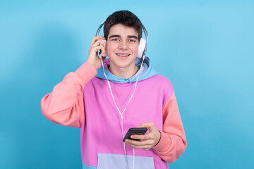 Poster - male teenager with headphones and mobile phone