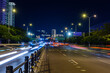 © Evgeniy - Night view of Sanya city with bright multi-colored illumination buildings, structures, roads, sidewalks, poles, bridges.