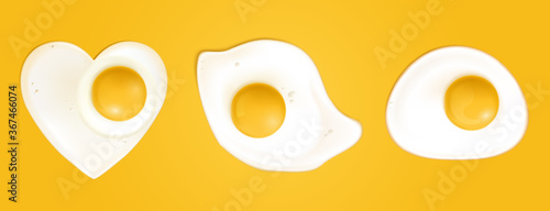 Fotografía Fried eggs different shapes isolated on yellow background